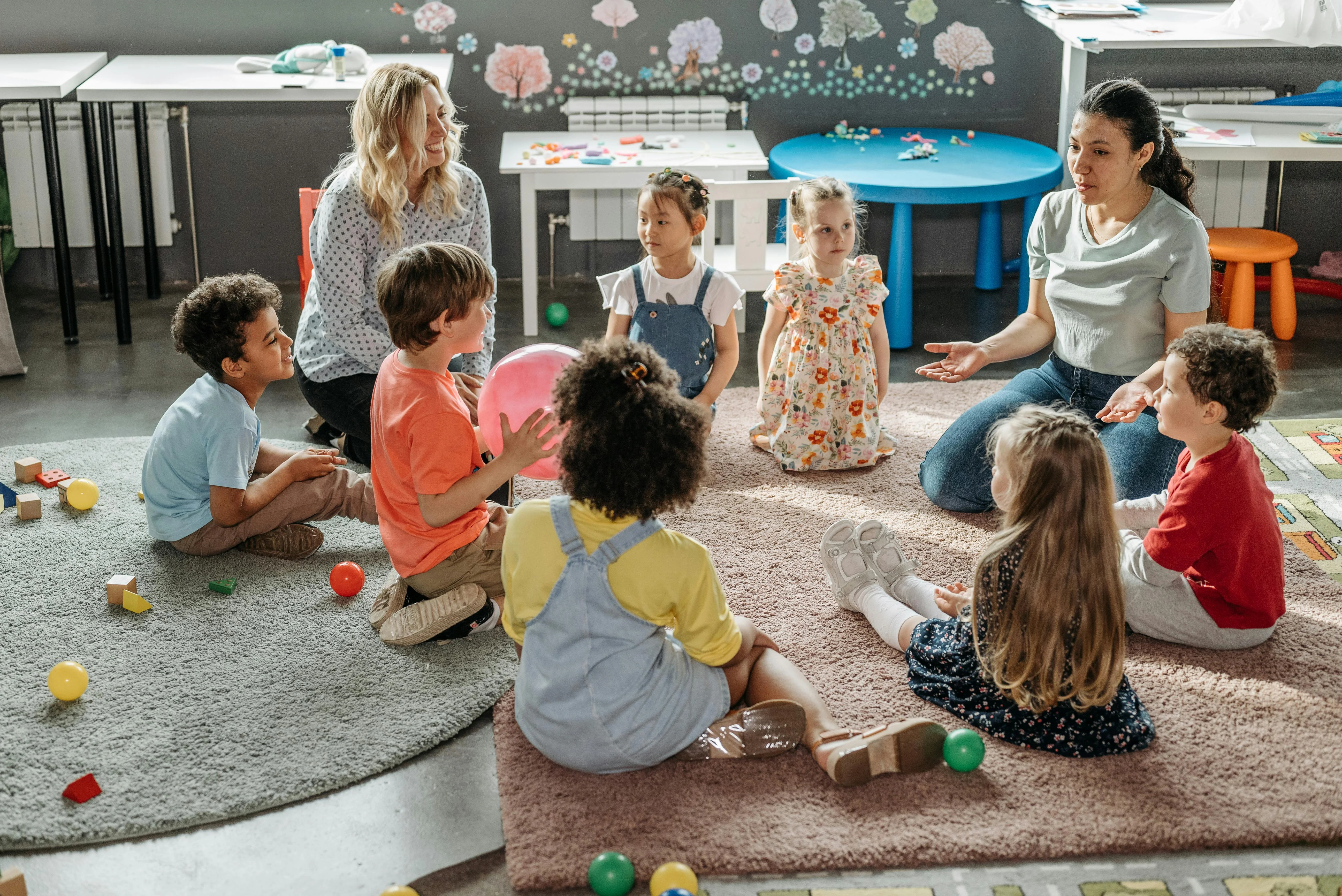 Children smiling in a childcare classroom